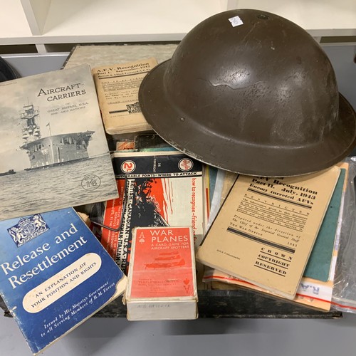 Mixture of military items to include WW2 helmet, and military ephemera.