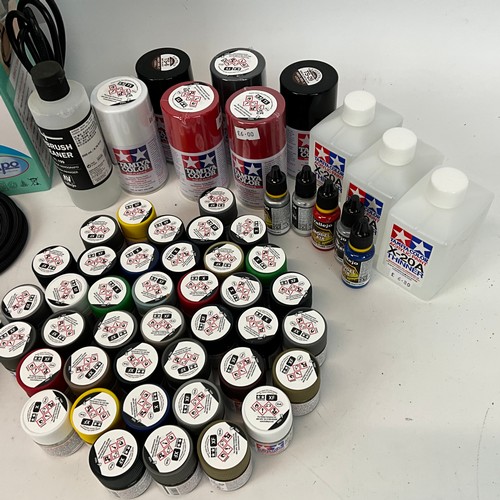 A collection of Tamiya model paints, paint thinners, plastic primers ...