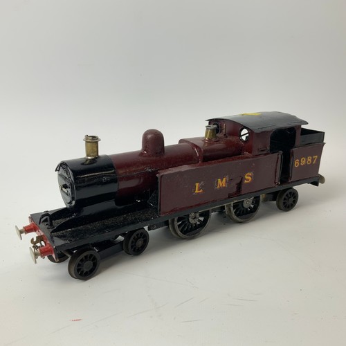 242 - Four O Gauge locomotives and two tenders, for restoration, to include LMS 6987, LNER, 1190.