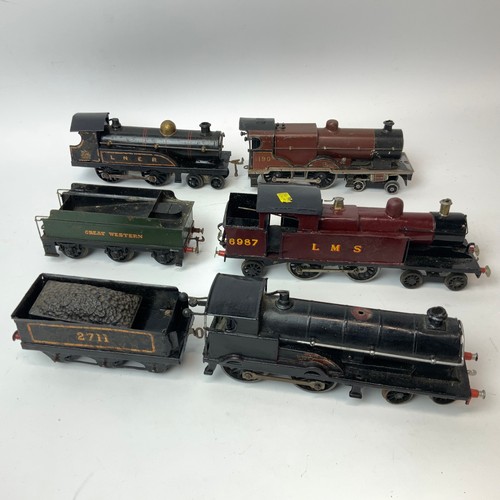 242 - Four O Gauge locomotives and two tenders, for restoration, to include LMS 6987, LNER, 1190.
