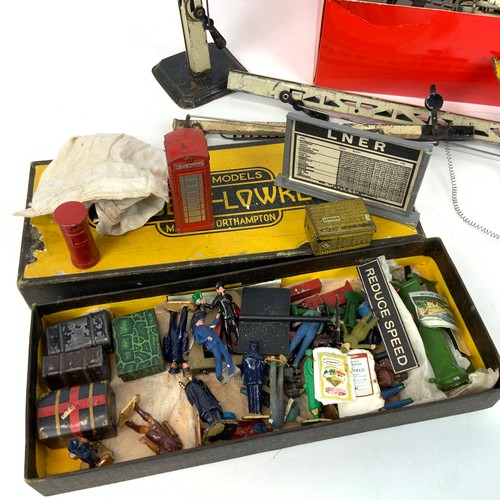 258 - An assortment of railway accessories, to include lead figures, signals, luggage, railway men and oth... 