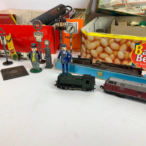 258 - An assortment of railway accessories, to include lead figures, signals, luggage, railway men and oth... 