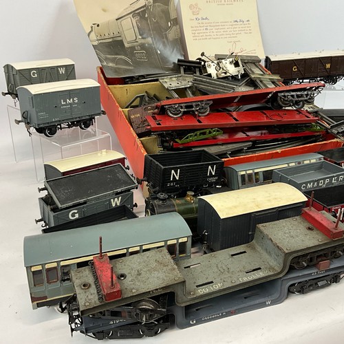 264 - O Gauge track and assorted coaches and wagons, to include WC& PR, GW, CM & D.R, H &L. In... 