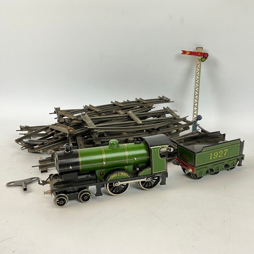 265 - A Duke of York clockwork model train by Bassett-Lowke of London and Northampton, accompanied by a bo... 