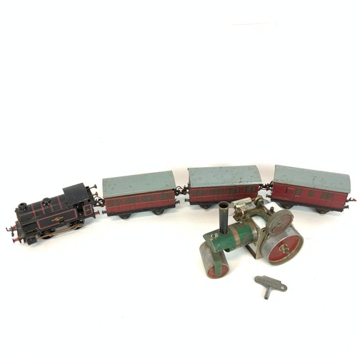 275 - Collection of three vintage Hornby O gauge carriages, a vintage Hornby type 40 clockwork train, and ... 
