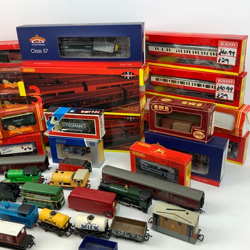 281 - A large collection of model trains, including locomotives and rolling stock from makers Hornby, Bach... 