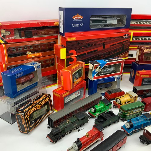 281 - A large collection of model trains, including locomotives and rolling stock from makers Hornby, Bach... 