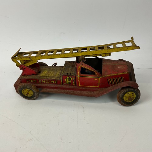 282 - A collection of items to include an AA badge, various lighters, a tin-plated winding clockwork fire ... 