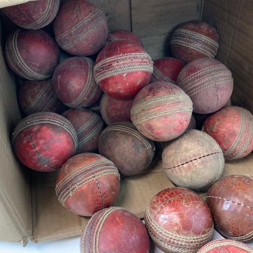 284 - A large collection of 35 vintage play-worn cricket balls, with examples by Readers, Ram cricket and ... 