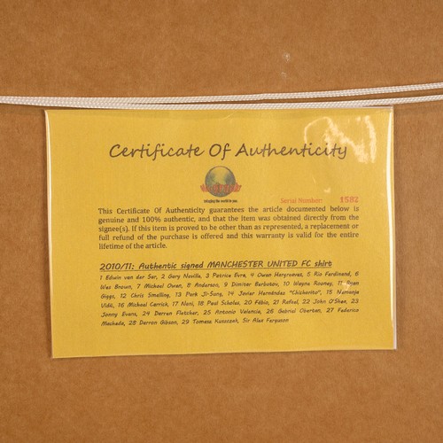285 - A 2010 Signed Manchester United football shirt framed and glazed, with a certificate of authenticity... 