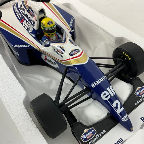 289 - Two Grand Prix legends, die-cast 1/18 scale F1 model cars, Ayrton Senna's Lotus and Williams.