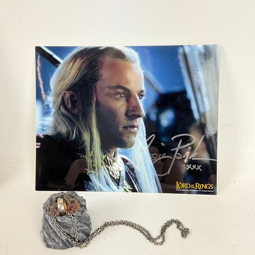 291 - Three Lord of the Rings memorabilia items, to include: a double film cell presentation in frame, a s... 