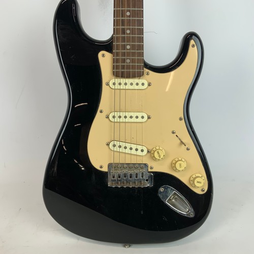 297 - A Fender Squire Stat electric guitar, along with a Fender Sidekick amp.