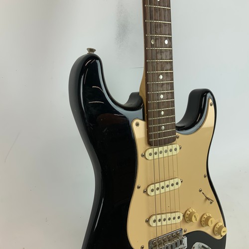 297 - A Fender Squire Stat electric guitar, along with a Fender Sidekick amp.