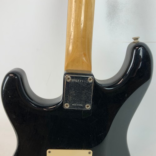 297 - A Fender Squire Stat electric guitar, along with a Fender Sidekick amp.