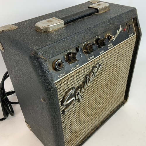 297 - A Fender Squire Stat electric guitar, along with a Fender Sidekick amp.