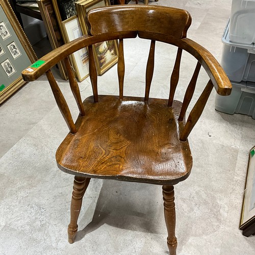 32 - An oak and pine smokers' chair.