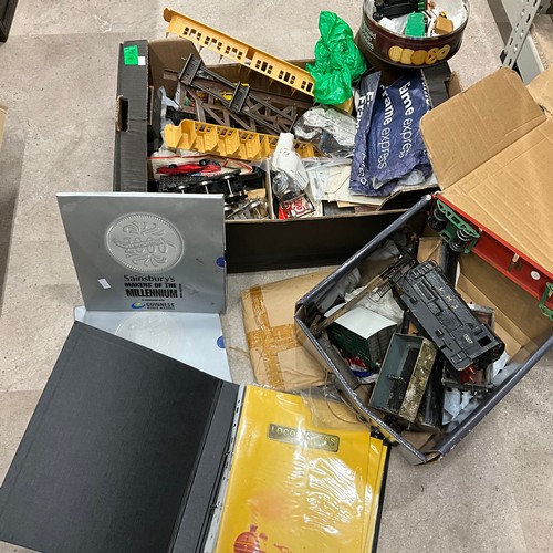 19 - An assortment of railway collectables, Sainsbury world records, Dinky toy, Corgi, Thomas the Tank En... 