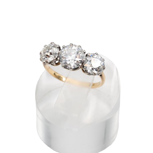 7 - 18ct gold and three-stone diamond ring, the old European cut diamonds measuring approximately 3.00 c... 
