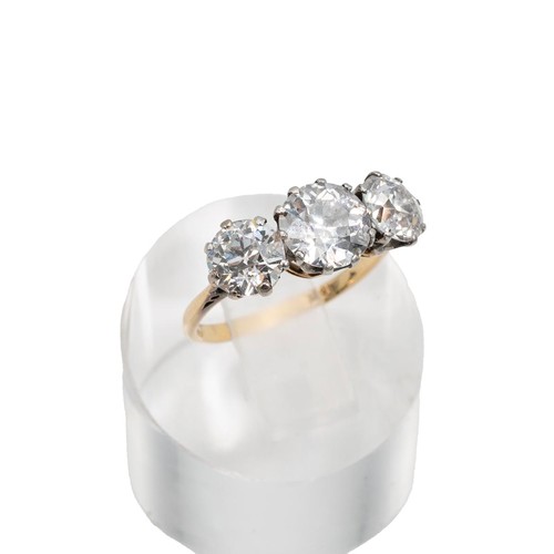 7 - 18ct gold and three-stone diamond ring, the old European cut diamonds measuring approximately 3.00 c... 