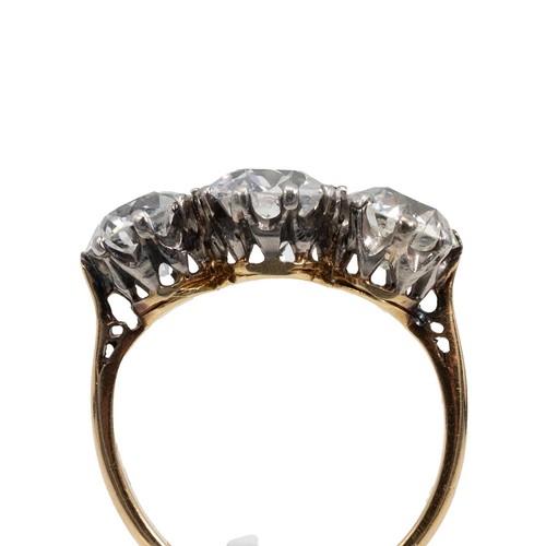 7 - 18ct gold and three-stone diamond ring, the old European cut diamonds measuring approximately 3.00 c... 