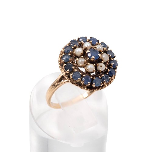 50 - 9ct gold sapphire and opal dress ring (by repute Russian) of circular form, the central sapphire sur... 