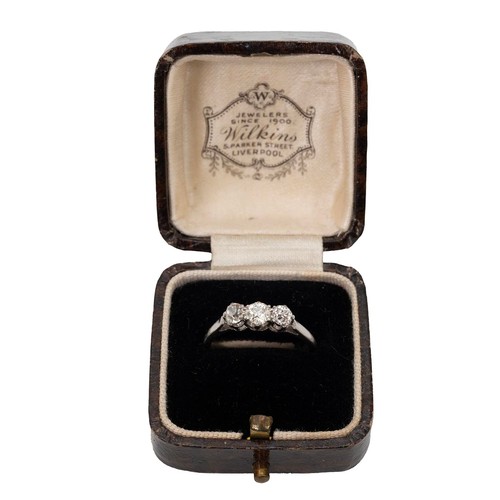 81 - A platinum set three stone diamond ring, the centre stone approx 0.15ct flanked by two further diamo... 