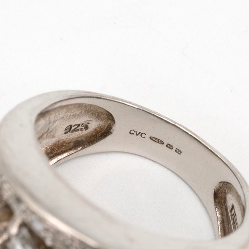 99 - Two silver gem set rings one set with a central set sapphire flanked with diamonds to the shoulder, ... 