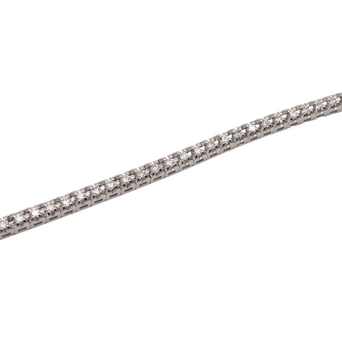154 - 14ct white gold (tested) diamond tennis bracelet set with brilliant-cut diamonds and a push-pull cla... 