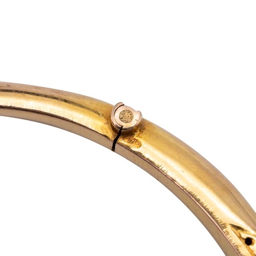 158 - 9ct gold hallmarked bangle, set with nine graduating amethysts flanked by six diamonds set in a rais... 