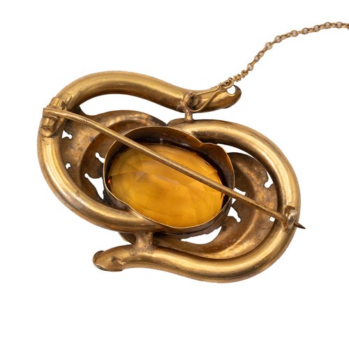 172 - A 19th-century brooch set with citrine decorated with acanthus and engraved decoration.