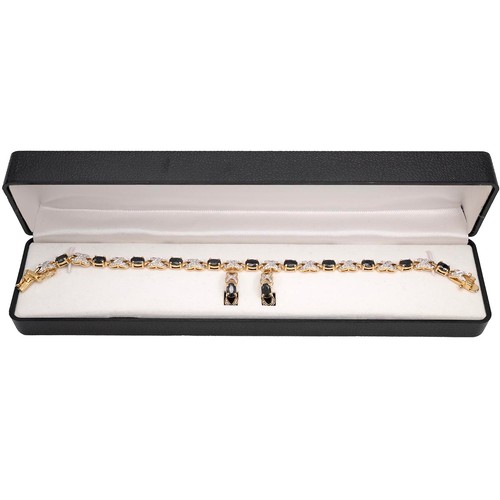 222 - A 14ct two-tone gold-plated sapphire bracelet, L19.5cm, and an earring set, in original box.
