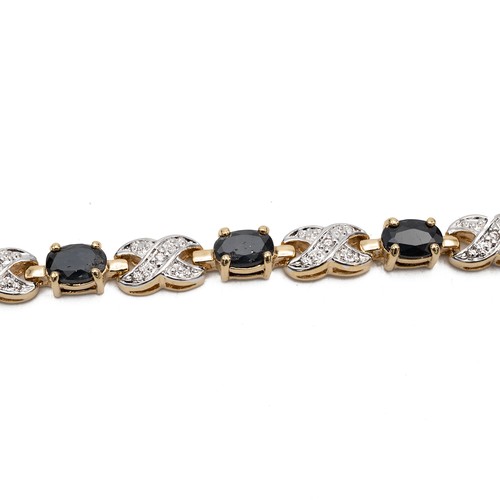 222 - A 14ct two-tone gold-plated sapphire bracelet, L19.5cm, and an earring set, in original box.