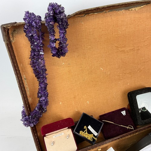 244 - A large collection of costume jewellery, including amethyst necklace, cufflinks, pendants, brooches,... 