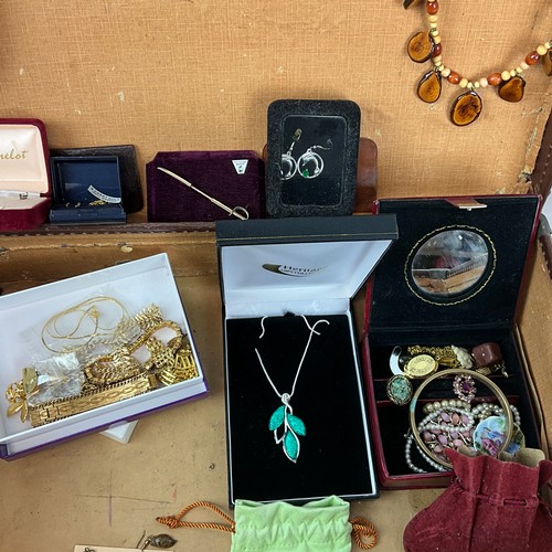 244 - A large collection of costume jewellery, including amethyst necklace, cufflinks, pendants, brooches,... 