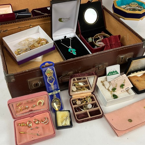 244 - A large collection of costume jewellery, including amethyst necklace, cufflinks, pendants, brooches,... 