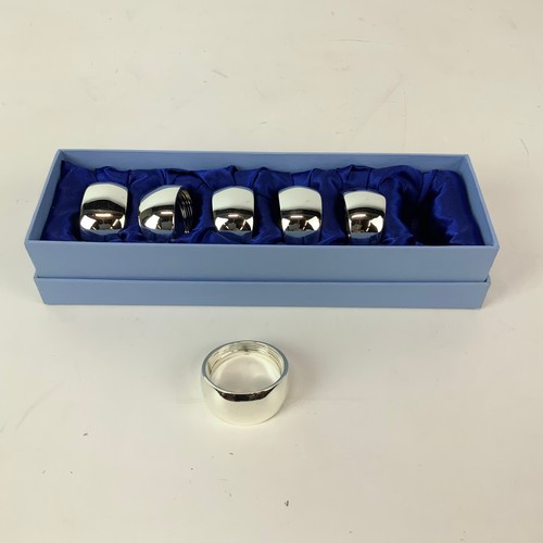 253 - An assortment of Newbridge metalware including napkin rings, boxed pen and costume jewellery etc.