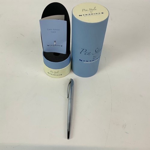 253 - An assortment of Newbridge metalware including napkin rings, boxed pen and costume jewellery etc.