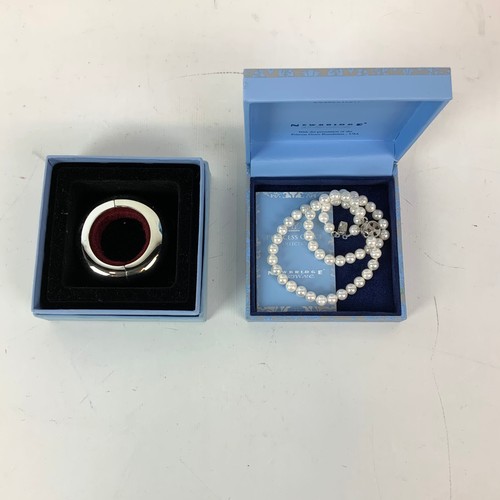 253 - An assortment of Newbridge metalware including napkin rings, boxed pen and costume jewellery etc.