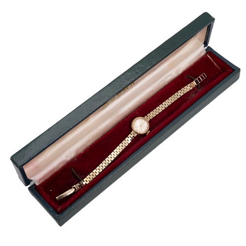 293 - 9ct gold hallmarked ladies Gudax cocktail watch and bracelet, with satin dial and Arabic numerals, g... 