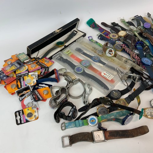 326 - A collection of Swatch watches, along with various others and watch batteries