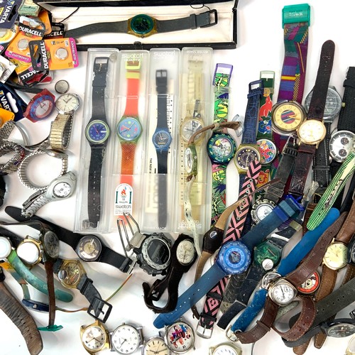 326 - A collection of Swatch watches, along with various others and watch batteries