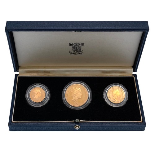 426 - Royal Mint, a gold proof three coin collection 1988 comprising two pounds £2, sovereign and half sov... 