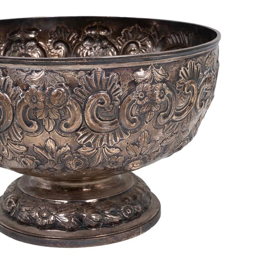 359 - A silver bowl with embossed rose and foliate decorations, engraved cartouche to Arthur E Mills, on s... 