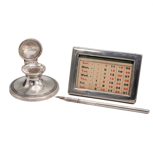 407 - A desk set in a leather box comprising an inkwell, hallmarked Birmingham 1912, complerte with tolled... 