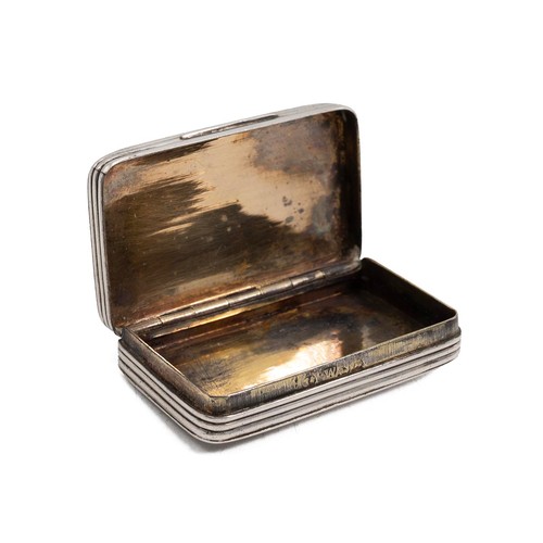 404 - A silver hallmarked snuff box of rectangular form with ribbed textured decoration, gilt interior, ha... 