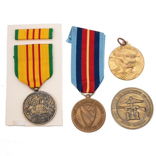 609 - A collection of three United States Vietnam War medals, to include the 1st Air Cavalry Division 'Fir... 