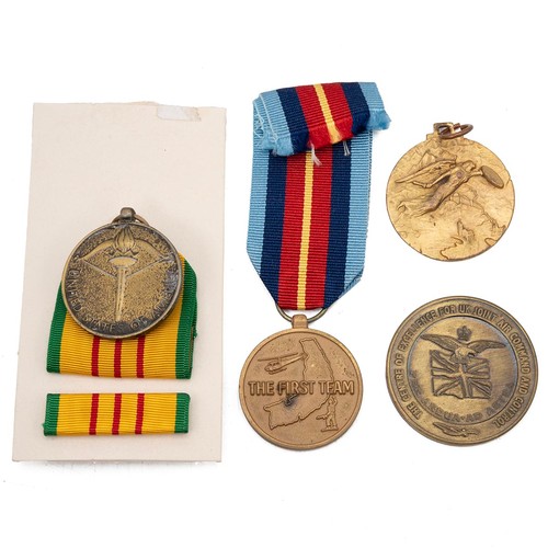 609 - A collection of three United States Vietnam War medals, to include the 1st Air Cavalry Division 'Fir... 