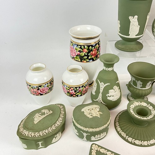 661 - A collection of Wedgwood green jasperware to include four ashtrays, various trinket dishes, vases, h... 