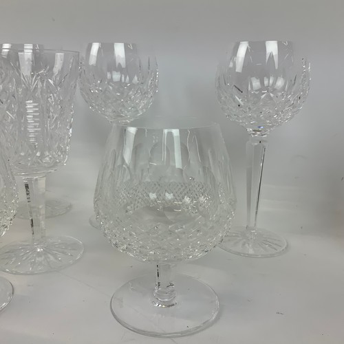 664 - A collection of 29 Waterford crystal glasses, to include tumblers, sherry glasses, wine glasses and ... 